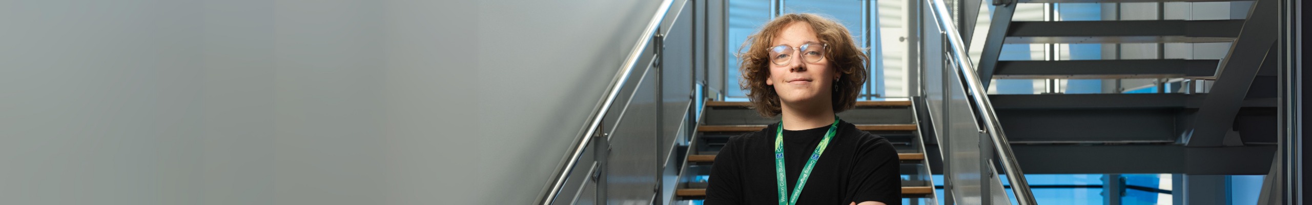 male engineering student in front of staircase