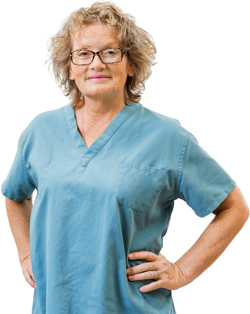 mature female midwife smiles with hands on hips