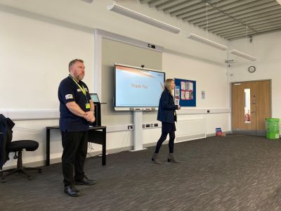 Hinkley Point Recruitment Team delivering talk to students stood in front of screen