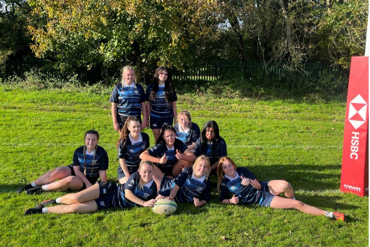 Weston sport girls rugby team picture on pitch