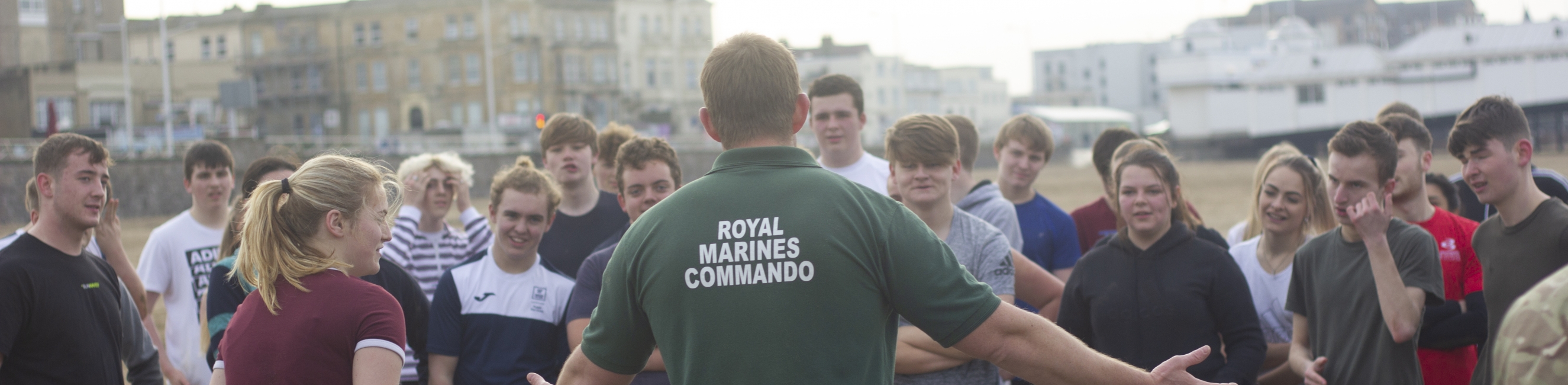 marine talking to students