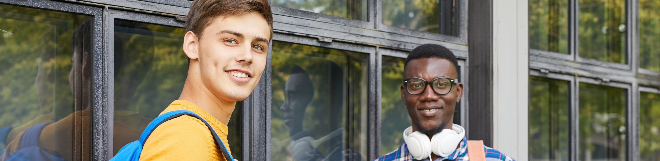 Two learners smiling at the camera