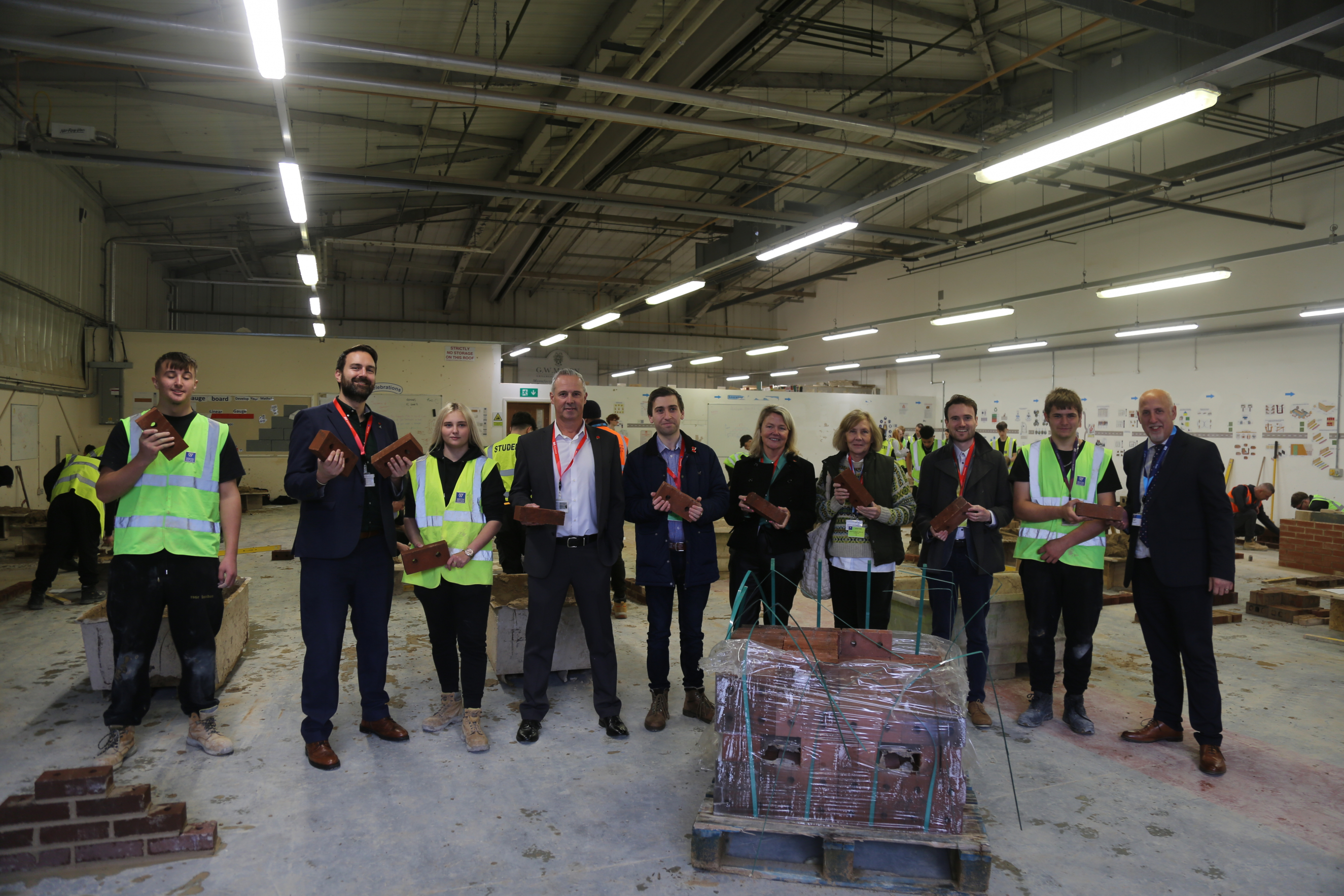 Persimmon, Dan Aldridge and Councillors visit Weston College for brick donation