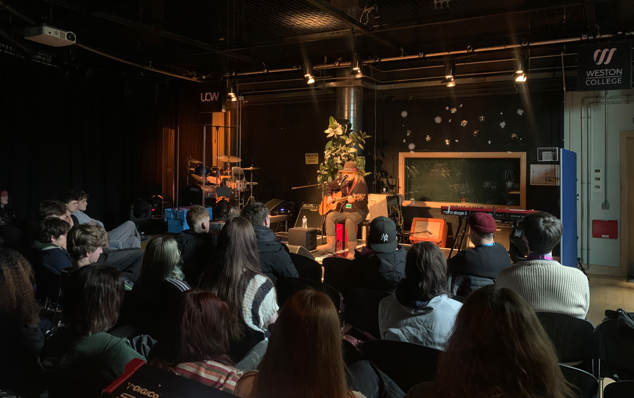 Guthrie Kennard performing on stage to the Music students
