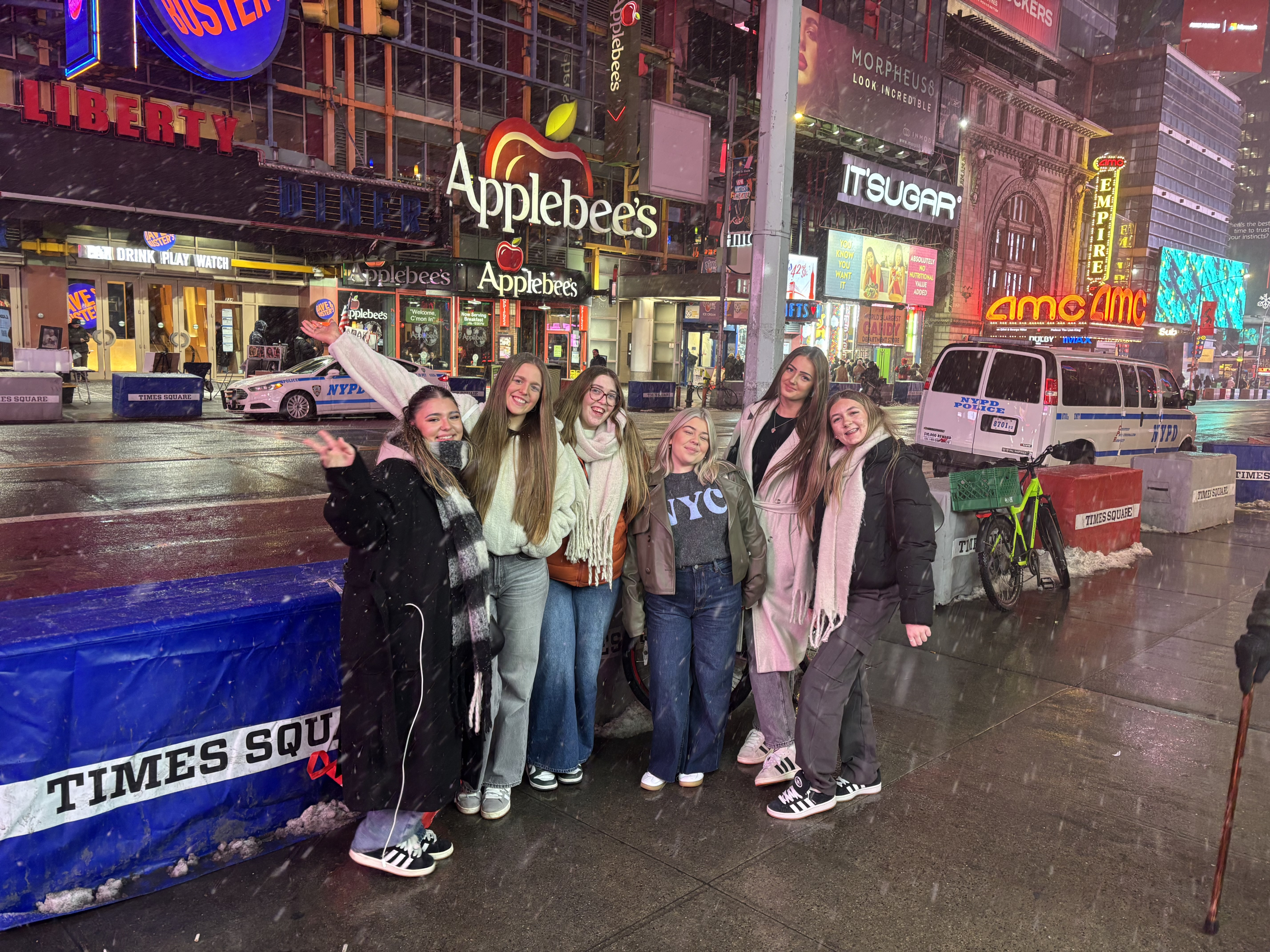 Students standing in Times Square in the snow