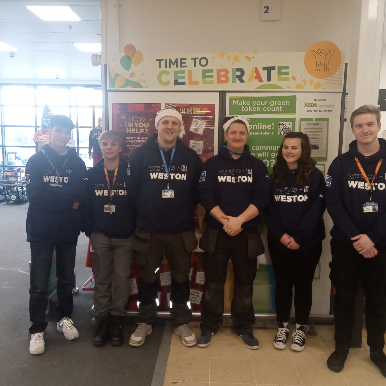 Learners smiling whilst supporting community at Asda