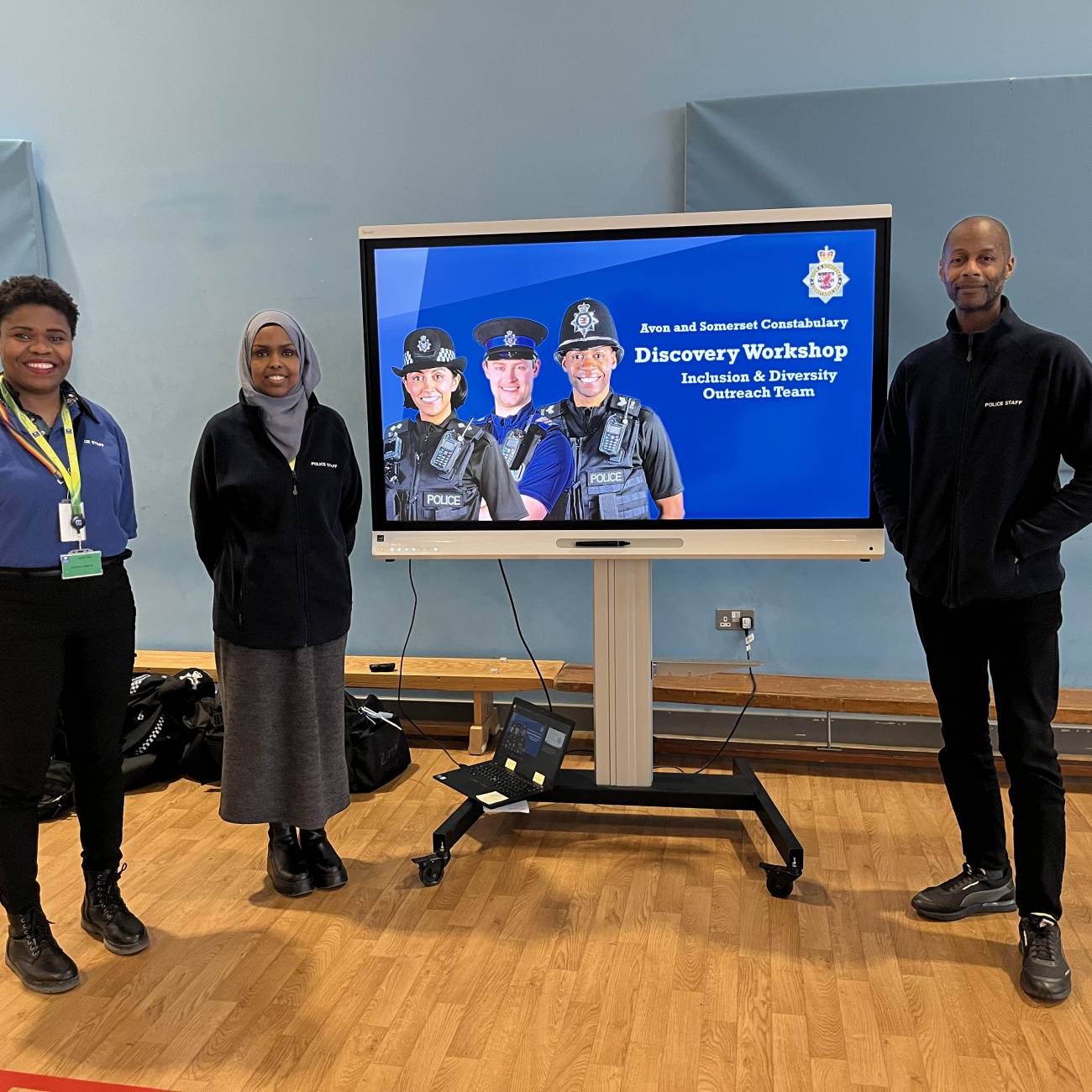 the police outreach team standing in front of their presentation