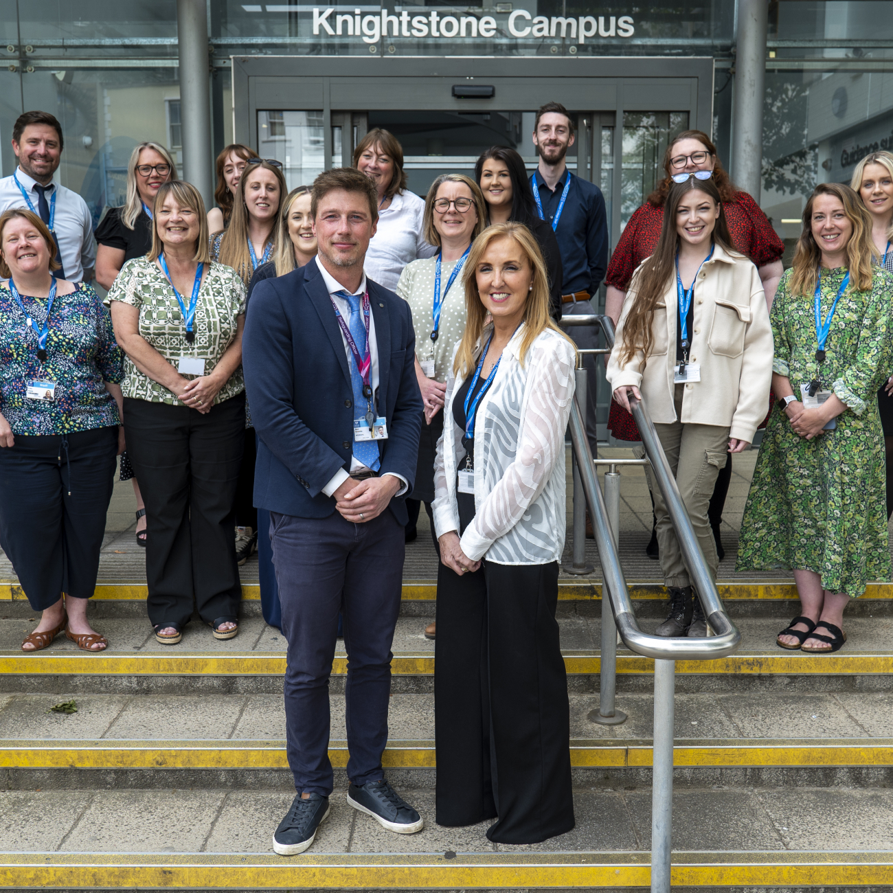 Staff gathered together in front of Knightstone celebrating the matrix accreditation