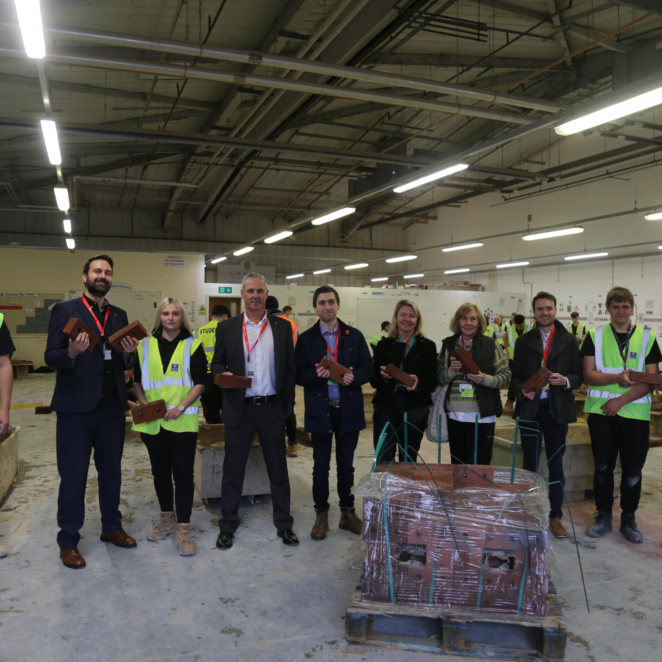 Persimmon, Dan Aldridge and Councillors visit Weston College for brick donation