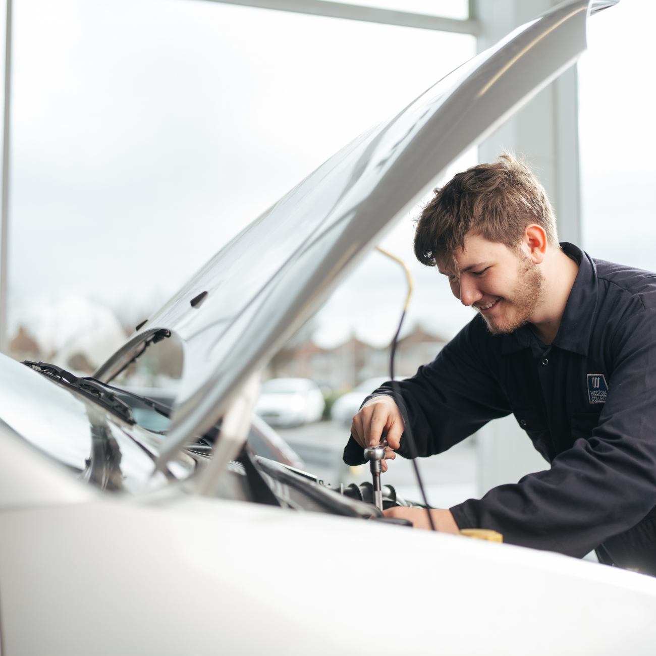 Student fixing car