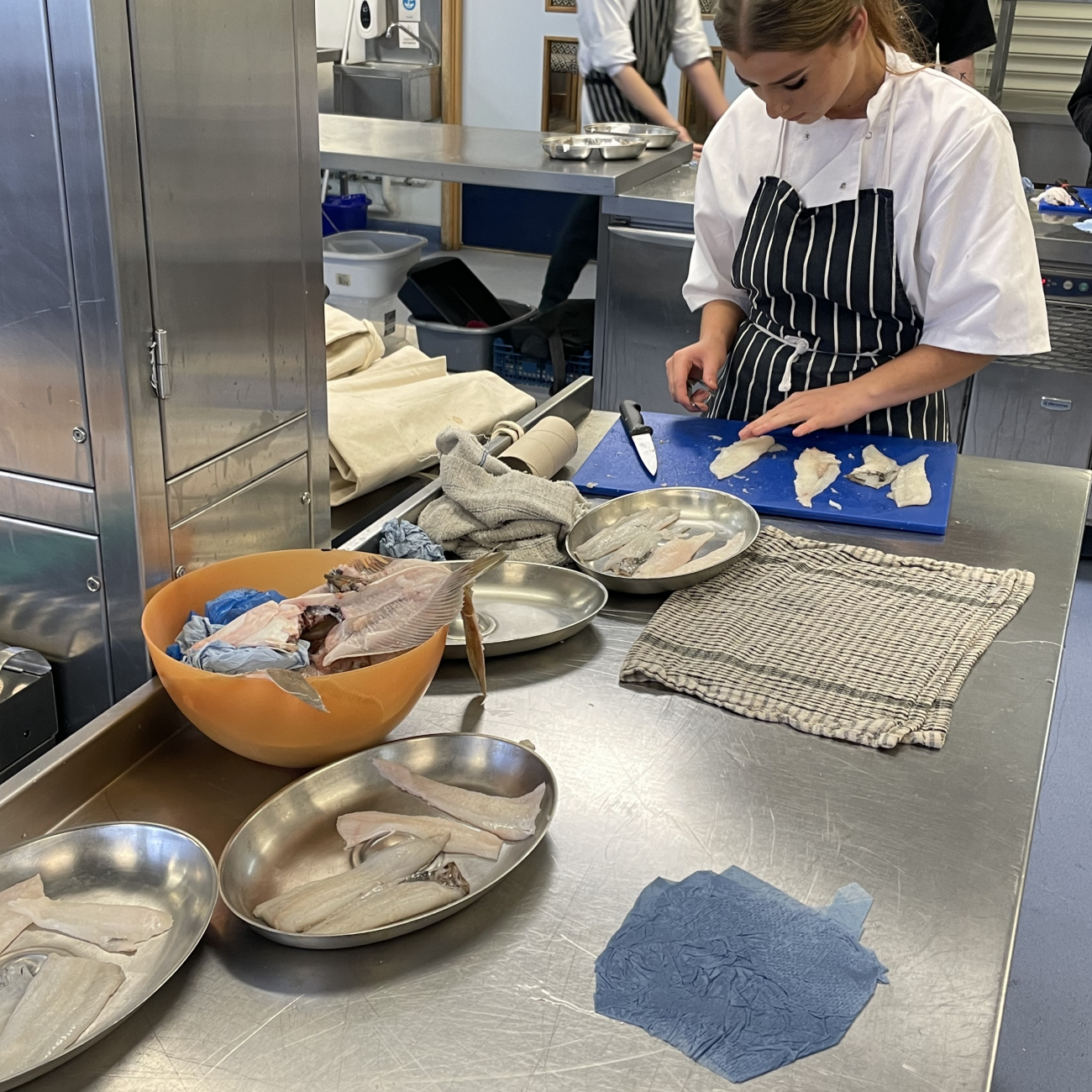 Student cutting up fish during Thatcher's Takeover