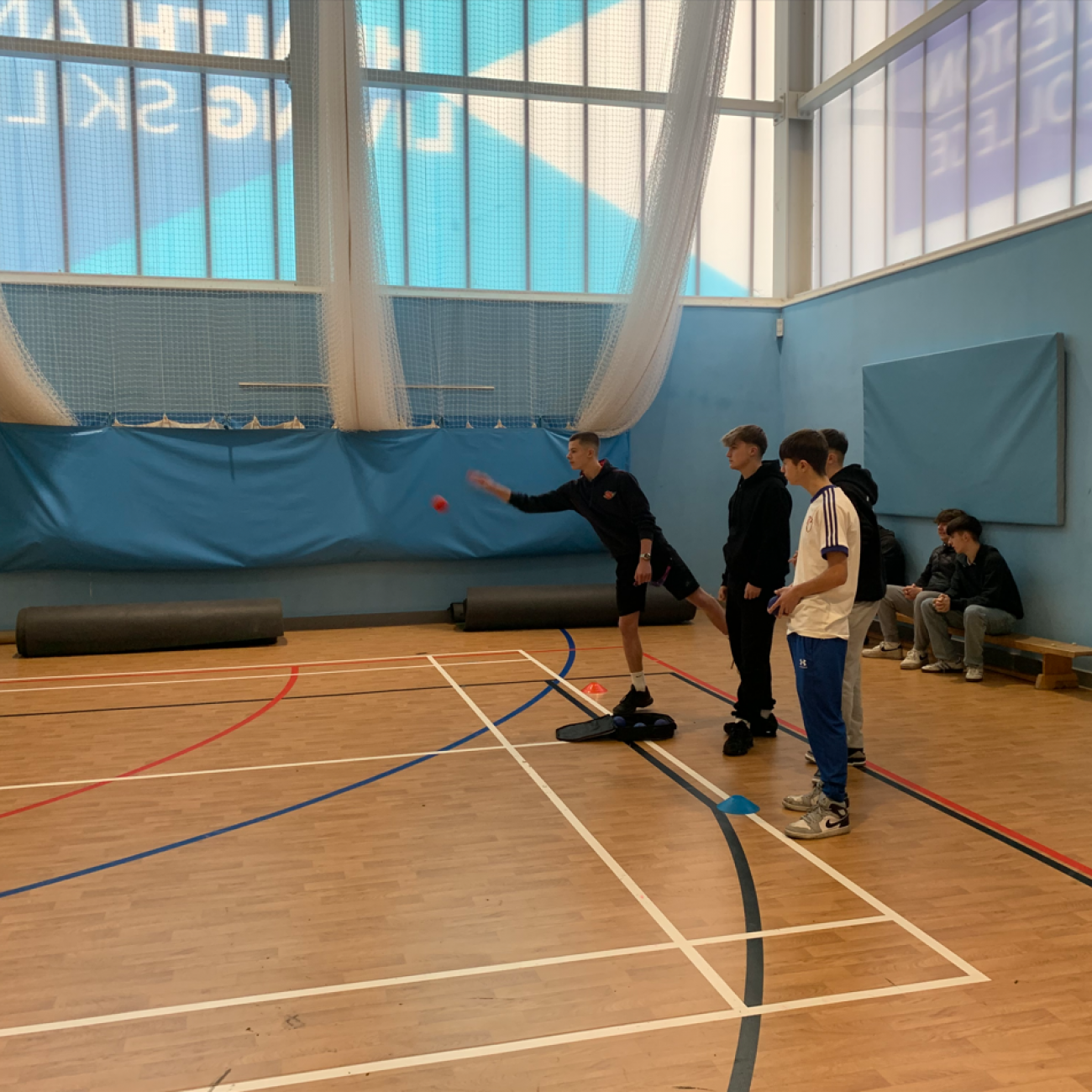 Sport coaching learners demonstrating boccia to the young learners