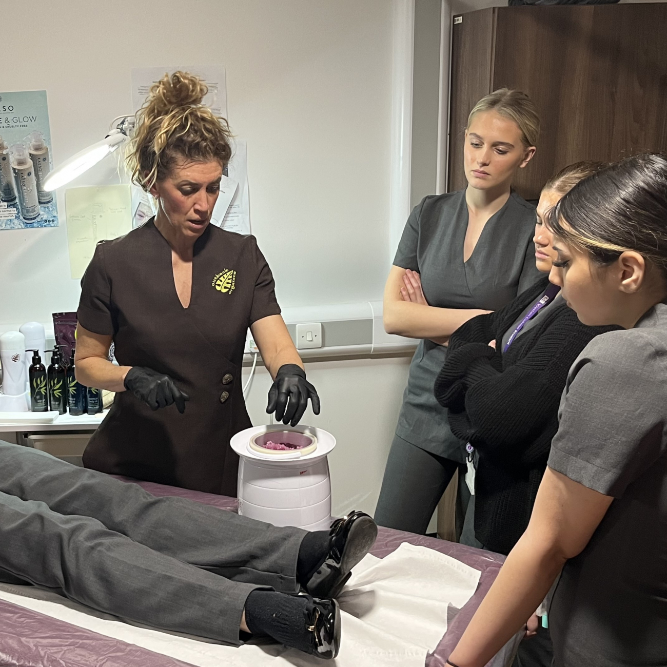 beauty therapy students learning from industry expert claire from outback organics