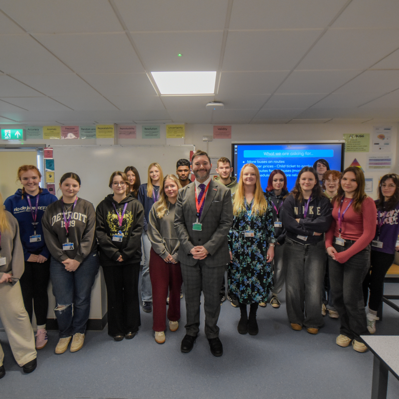 Sadik Al-Hassan standing with the A Level Environmental Health students