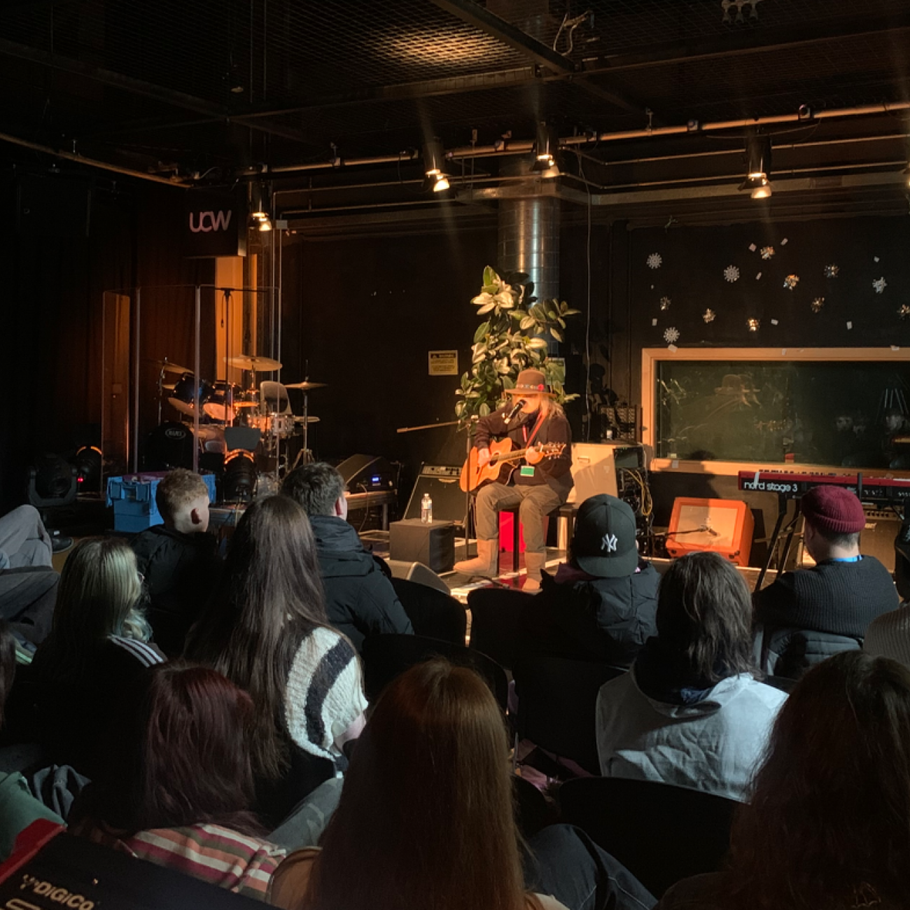 Guthrie Kennard performing on stage to the Music students