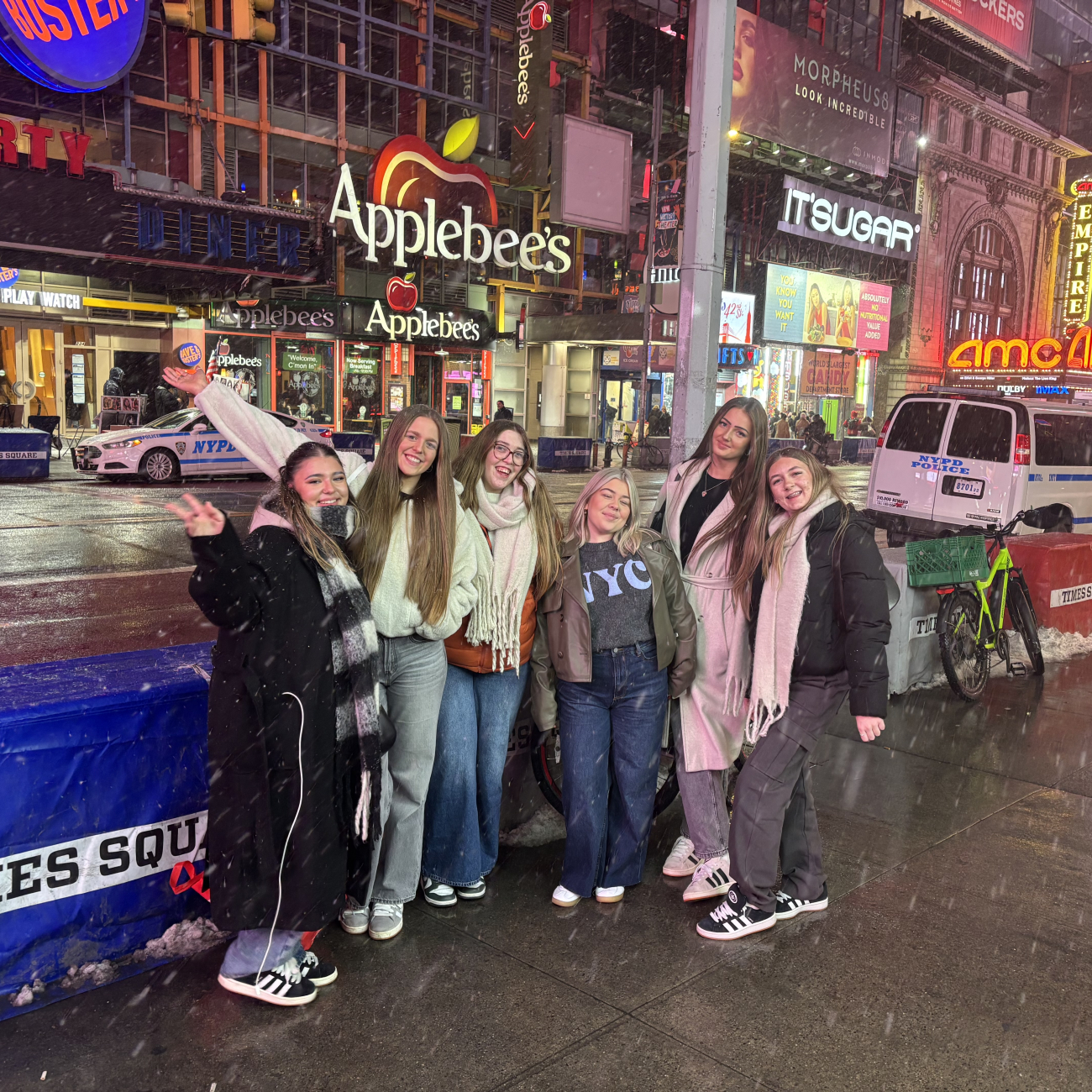 Students standing in Times Square in the snow