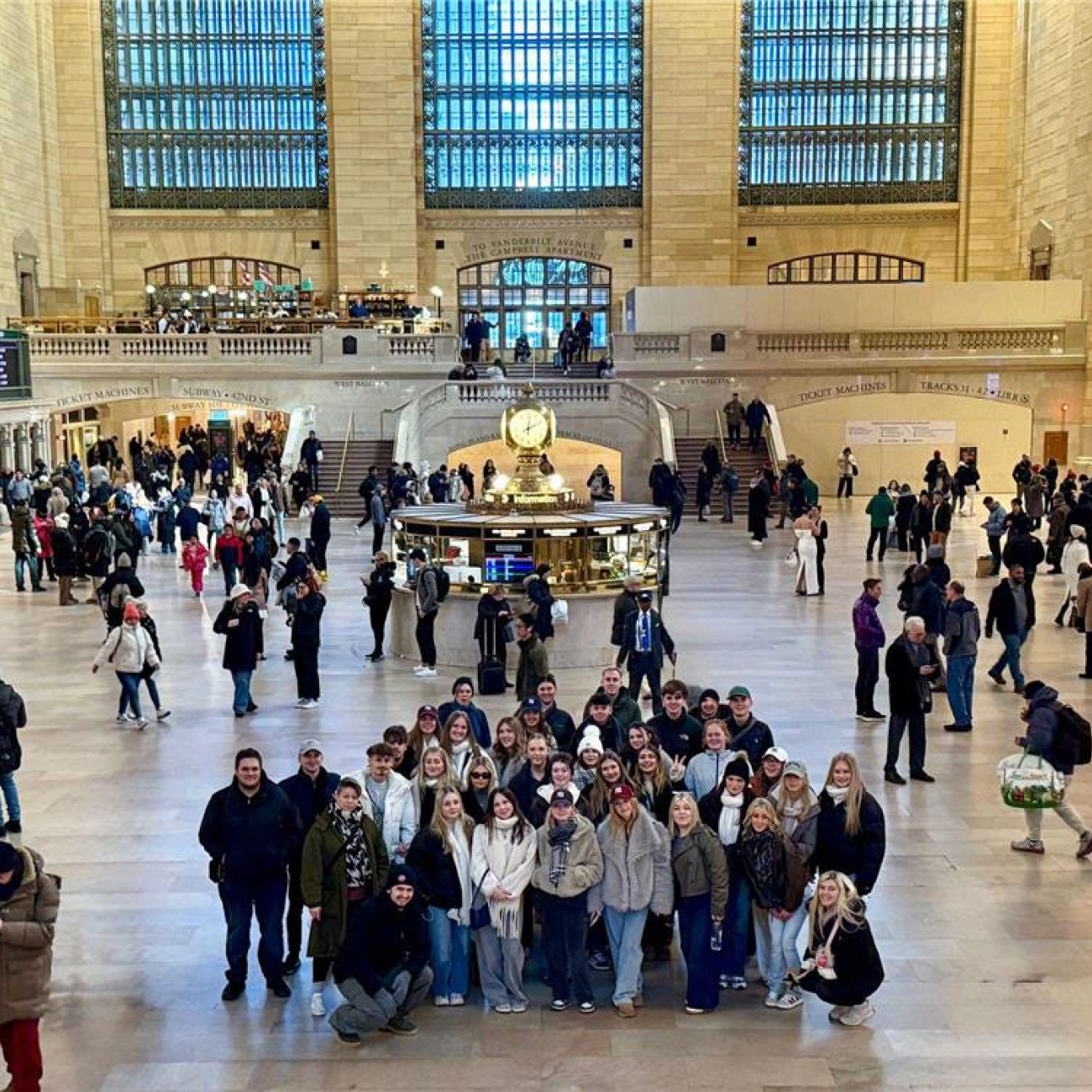 Business and Travel students smiling in Grand Central Station