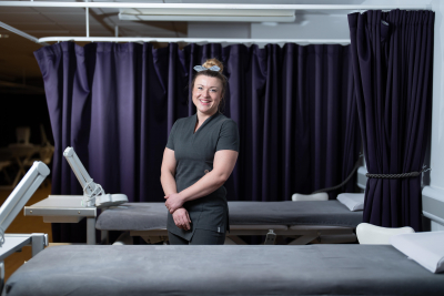 Martha standing in a treatment room