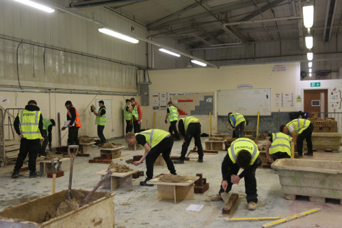 Bricklaying students using the new bricks donated by Persimmon Homes