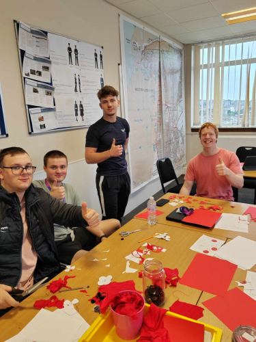 Protective Services learners making the poppies