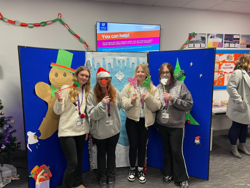 Learners with Christmas photo props