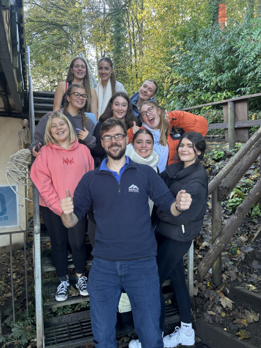 Travel and tourism learners posing with a worker at Mendip Activity Centre