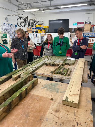 Students discussing how they can refurbish the old benches