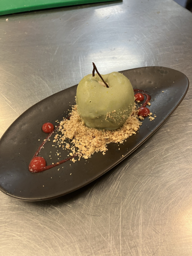 Apple crumble in the shape and style of a green apple