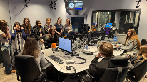 Learners in a broadcasting studio practising