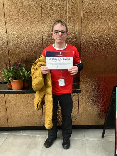 Jack holding his 4th place certificate