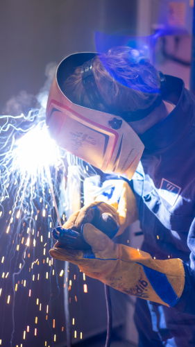 Aidan welding with a mask on