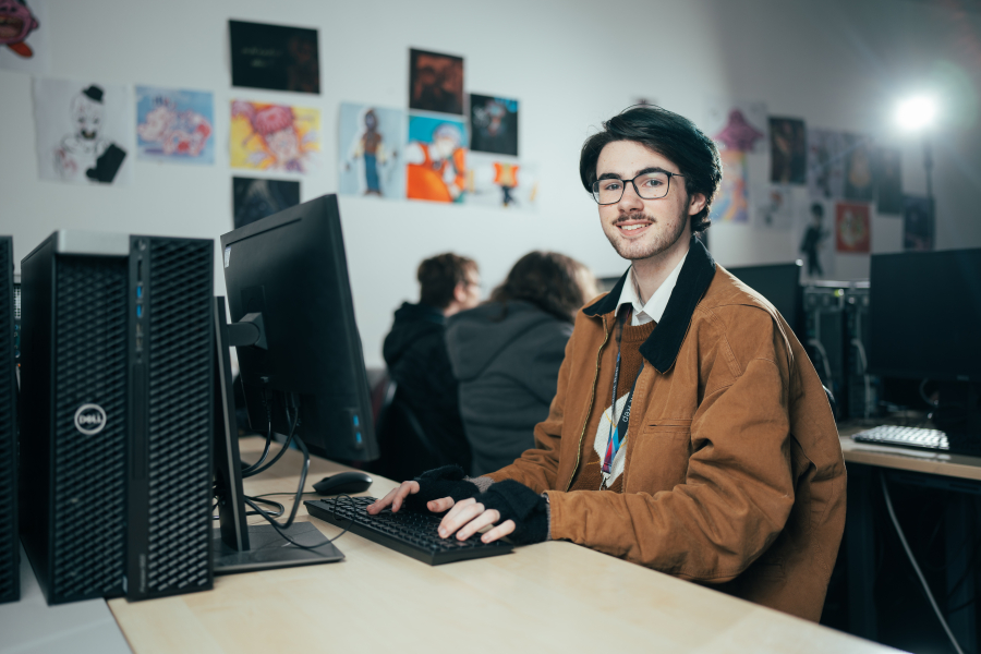 male student on computer