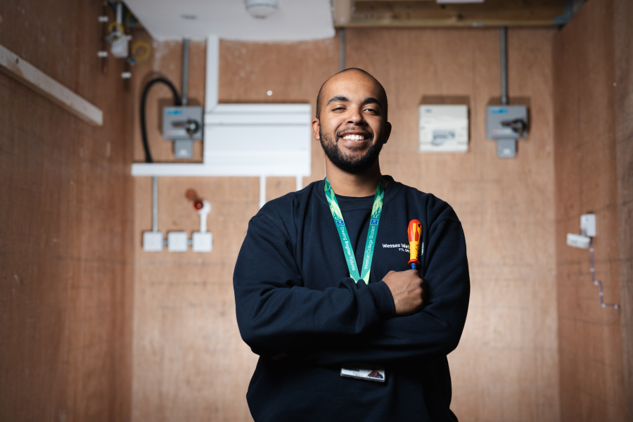 adult electrical student holding screwdriver