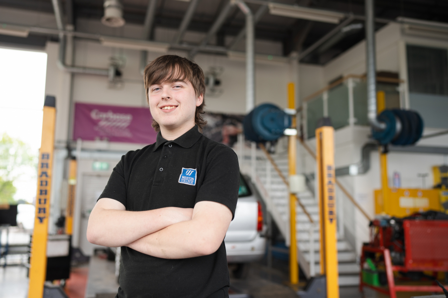 male motor vehicle student in workshop