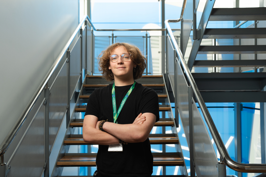 Male student in front of stairs