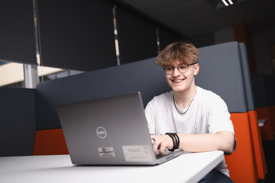 male student on computer