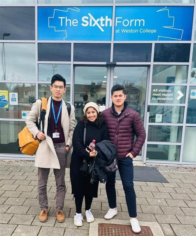 Lecturer Ethan Shi with Nour and Kenny stood outside Weston College's Sixth Form based at their Loxton Campus